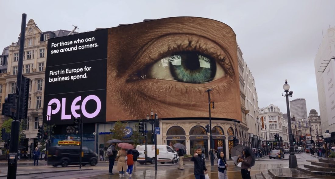 Pleo on the Piccadilly Lights screen next to other brands.